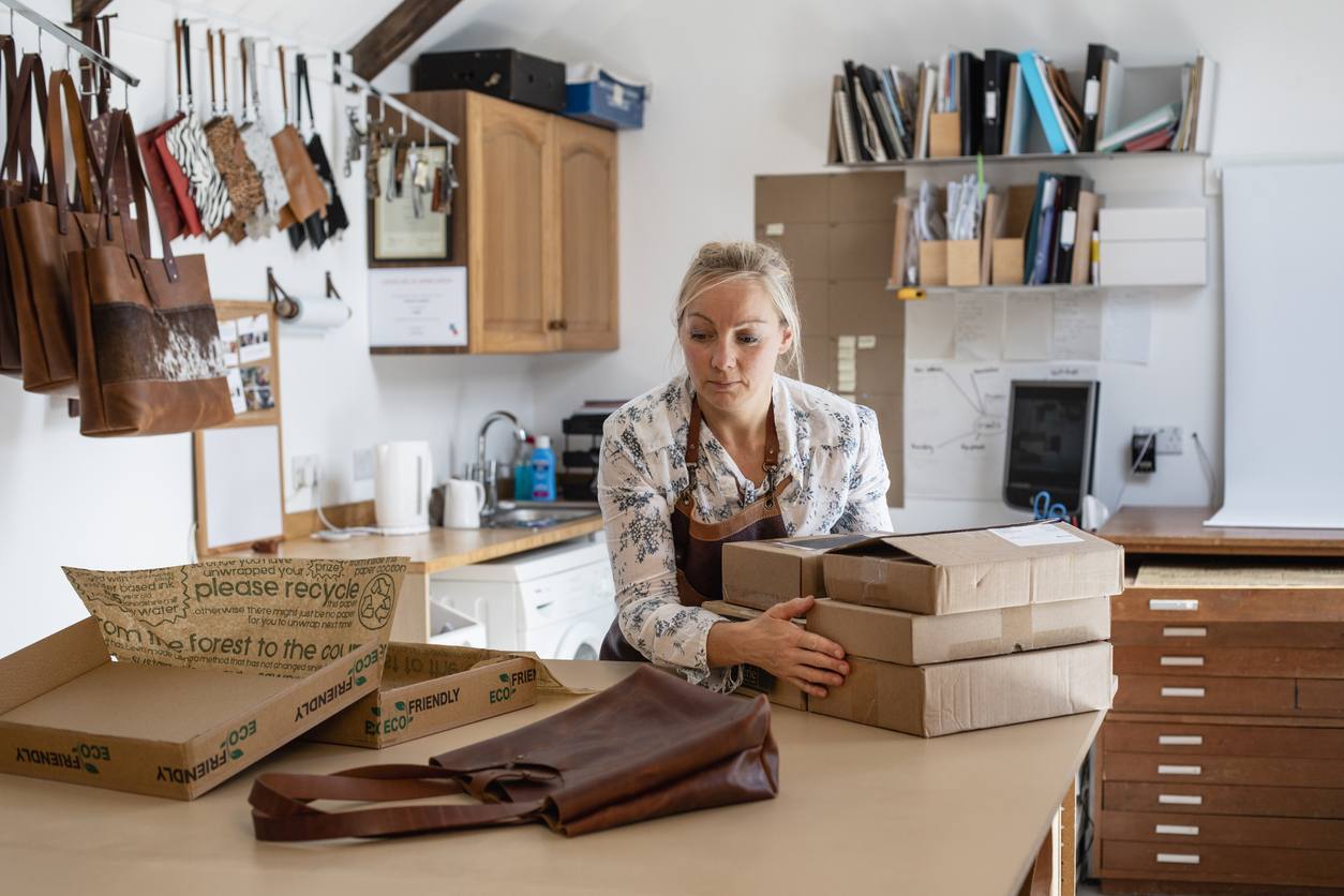 Susanna packing LeTuscany orders with care